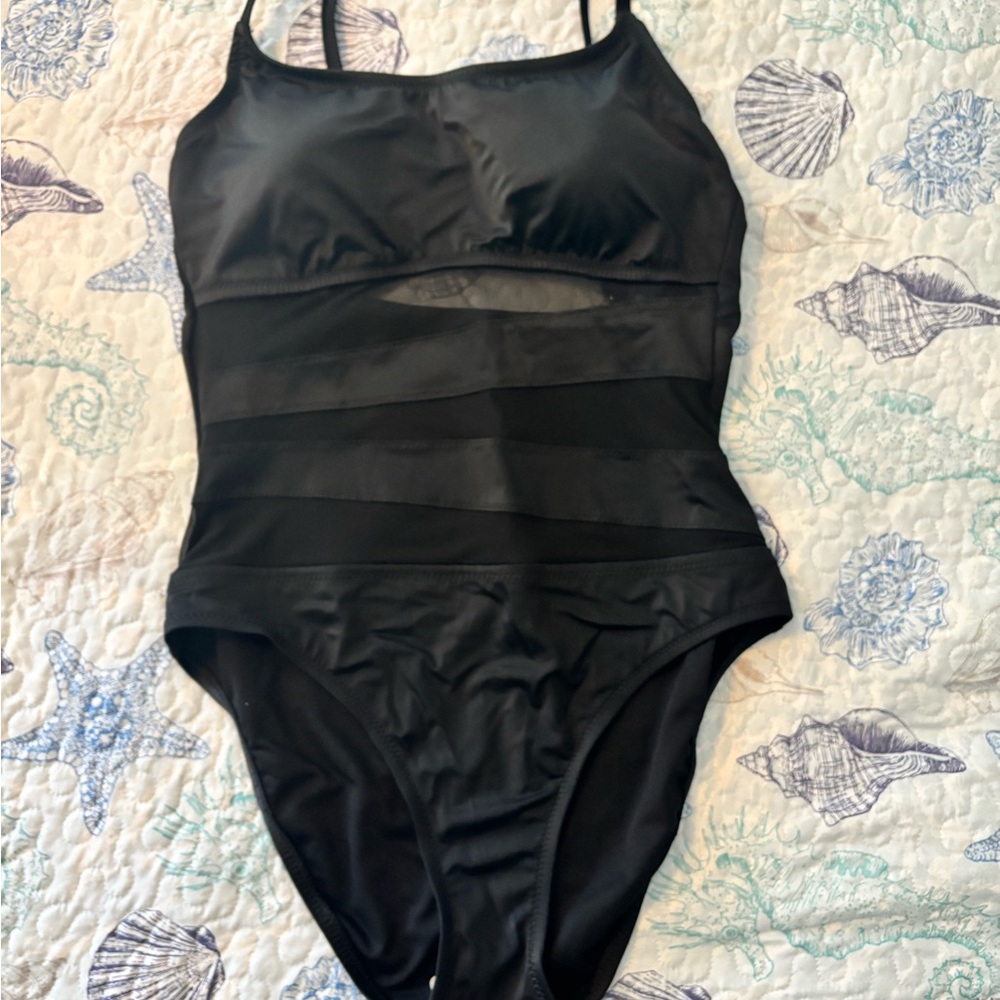 NEW! Don’t miss this Shade & Shore elegant black one piece with mesh accent.